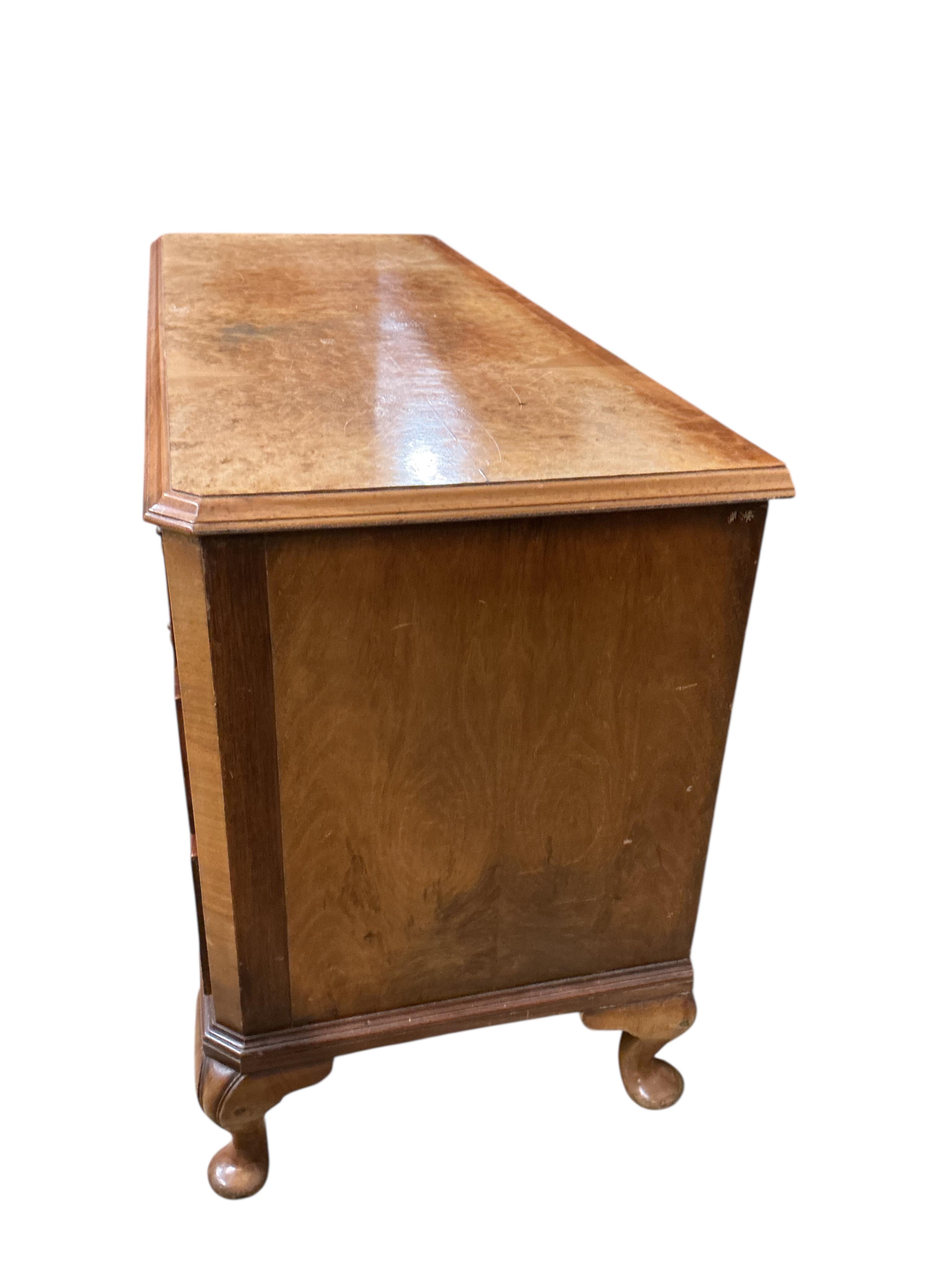 A Queen Anne Revival walnut low chest, width 124cm, depth 46cm, height 66cm